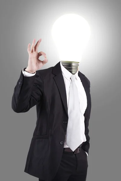 Homme d'affaires avec tête de lampe — Photo