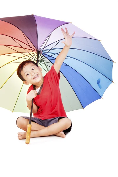 Ragazzino con ombrello multicolore — Foto Stock