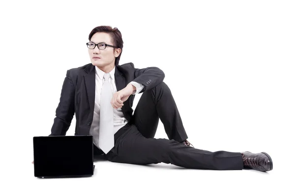 Zakenman met laptop op witte — Stockfoto