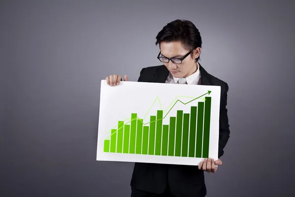 Businessman with green business chart — Stock Photo, Image