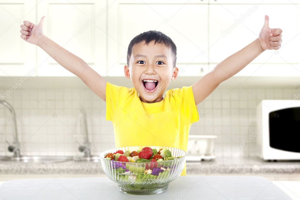 Pleased child with salad