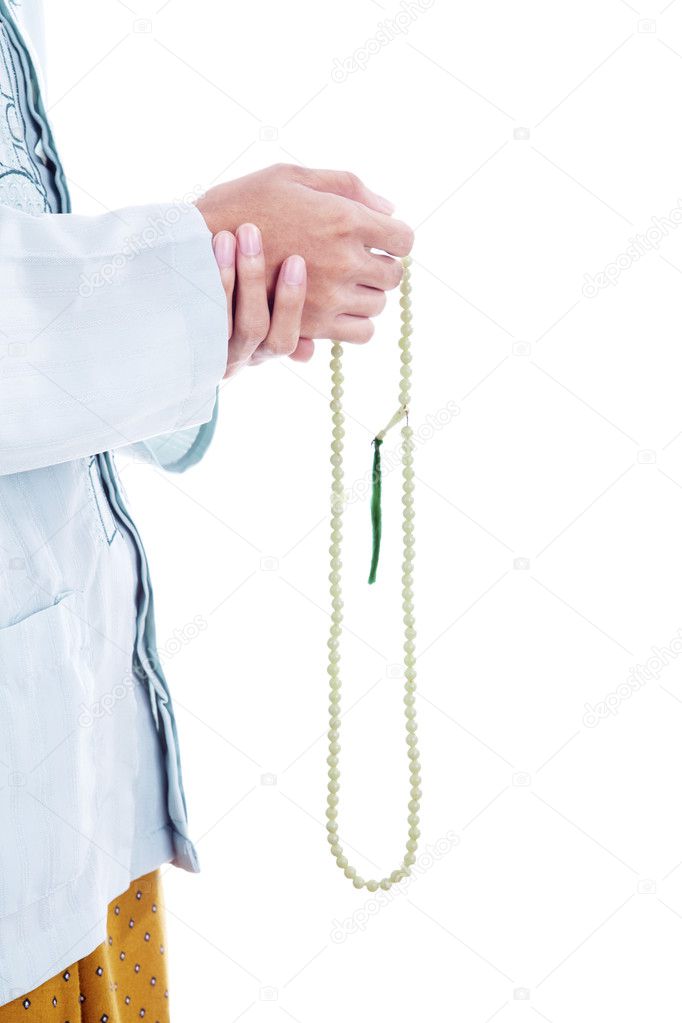 Holding prayer beads isolated on white