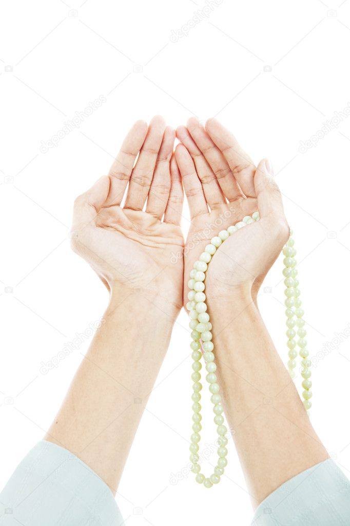 Muslim praying hands isolated on white