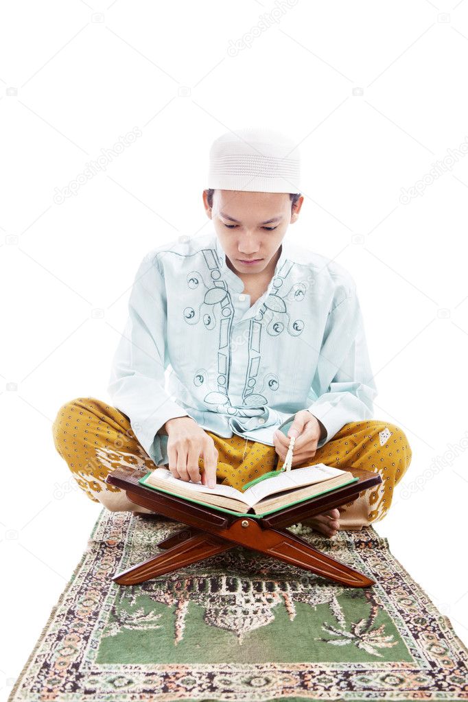 Muslim man reading quran