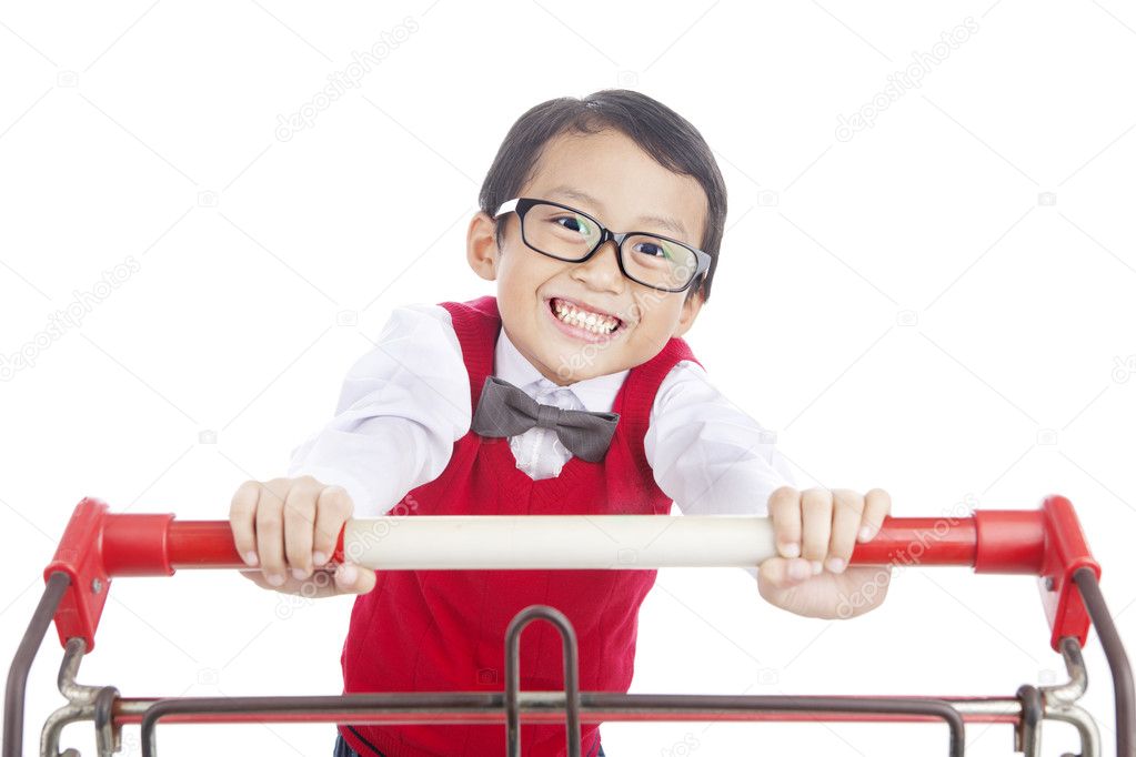 School child pushing trolley