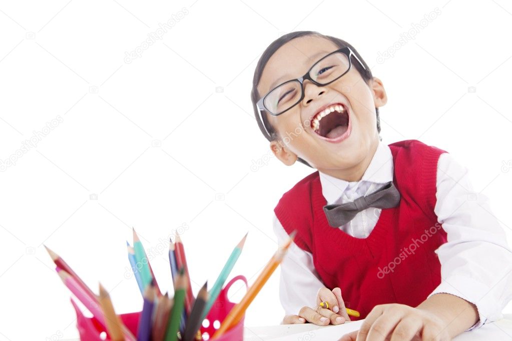 Cheerful pupil with crayon