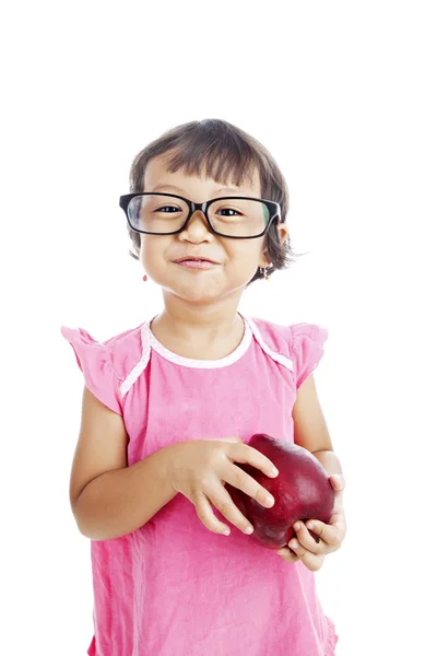 Sladká holčička drží jablko — Stock fotografie