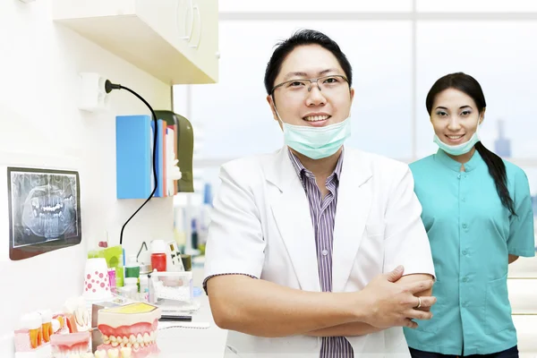 Dentist and his assistant Royalty Free Stock Photos