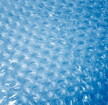 Bubble Wrap over blue background clipart