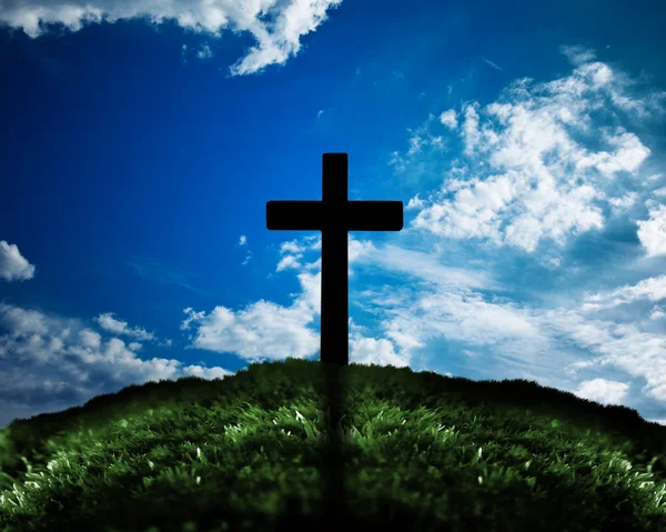 Silhouette of cross on a hill — Stock Photo, Image
