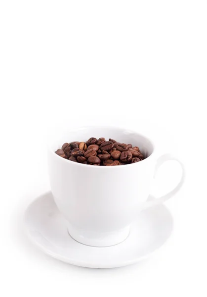 Tasse mit Kaffeebohnen Stockbild