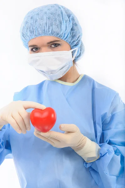 Female doctor holding a heart — Stock Photo, Image