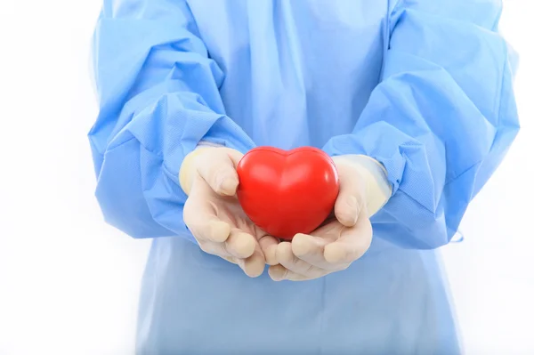 Sterile doctor holding heart — Stock Photo, Image