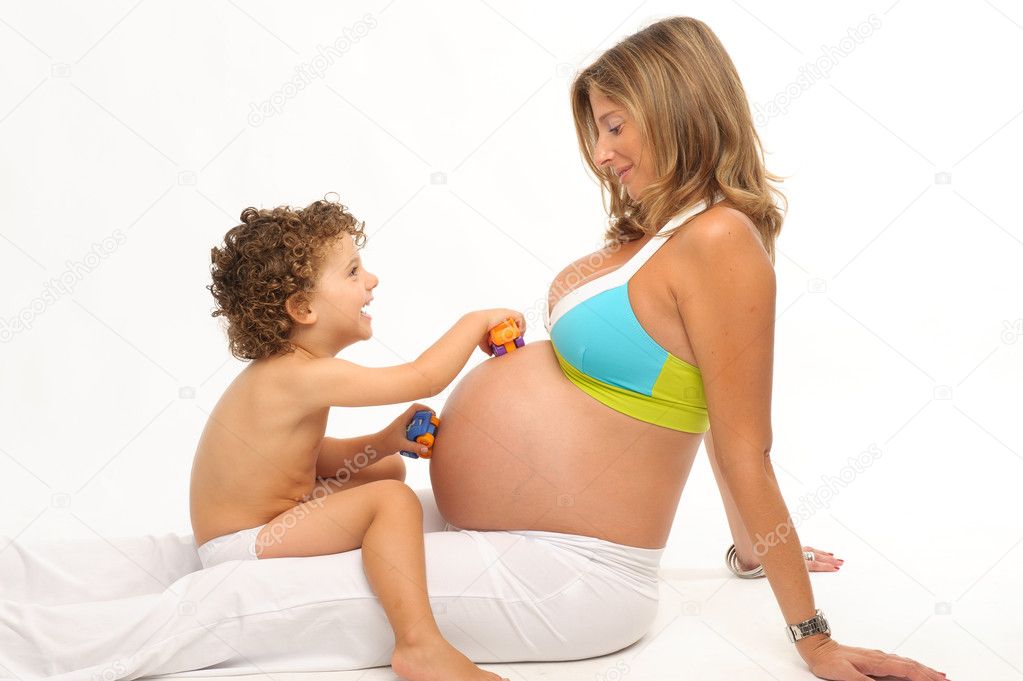 Pregnant woman and son playing