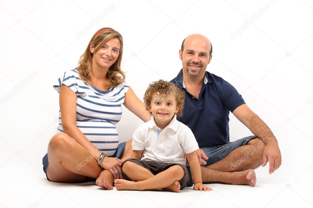 Happy family together with pregnant woman
