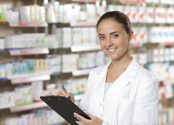 Portrait of Smiling Woman Pharmacist whit clipboard — Stock Photo, Image