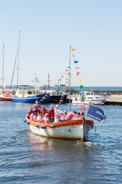 A tourist vessel with the members of a sailors choir clipart