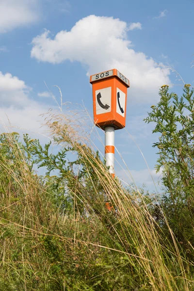 Emergency call post in a rural landscape — Stock Photo, Image