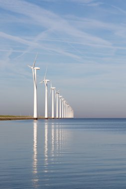 Dutch offshore wind turbines in a calm sea clipart