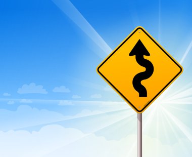 Winding road sign on blue sky clipart