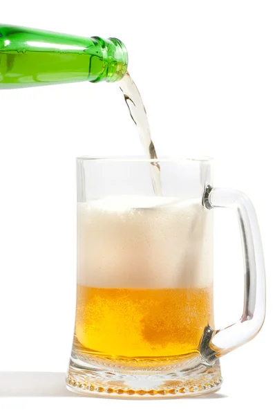Pouring Beer into glass on white — Stock Photo, Image