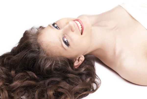 Young pretty woman lying on the floor, close up — Stock Photo, Image