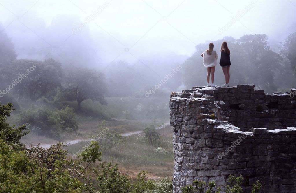 Women Overlooking Bright Foggy Valley