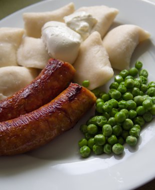 Perogies and sausages clipart