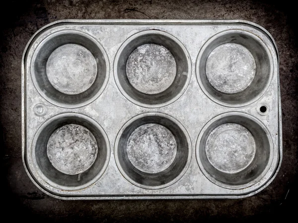 Muffin pan background — Stock Photo, Image