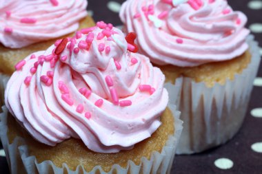 Cupcake with Pink Icing and Sprinkles clipart