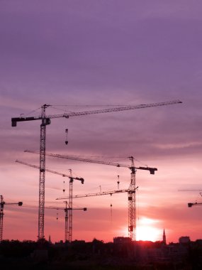 Tower Cranes At Sunset clipart