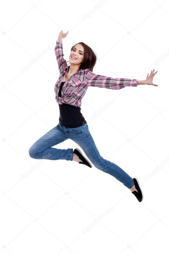 Happy teen girl jumping, isolated on white background