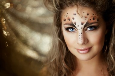 Girl with an unusual make-up as a leopard clipart