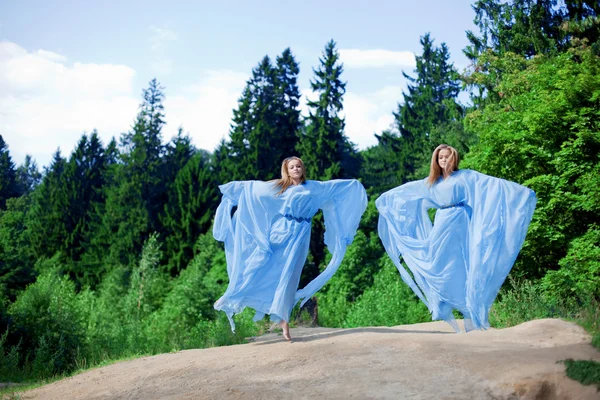 Two woman, twins in the forest — Stock Photo, Image