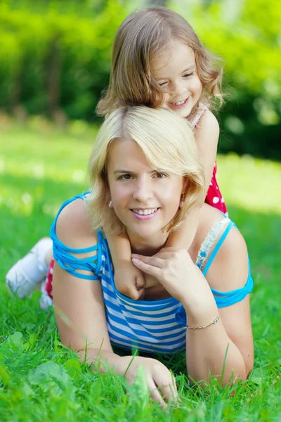 Mother and daughter hugging in the park Royalty Free Stock Images