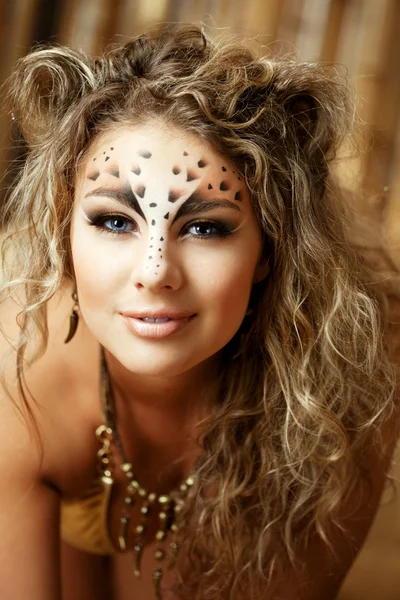 Girl with an unusual make-up as a leopard Royalty Free Stock Photos