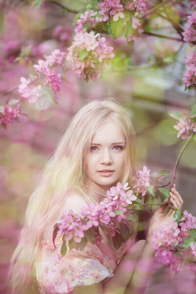 Beautiful woman and flowering tree