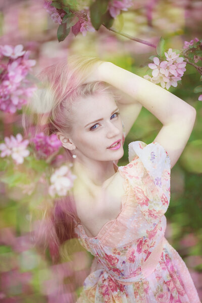 Beautiful woman and flowering tree