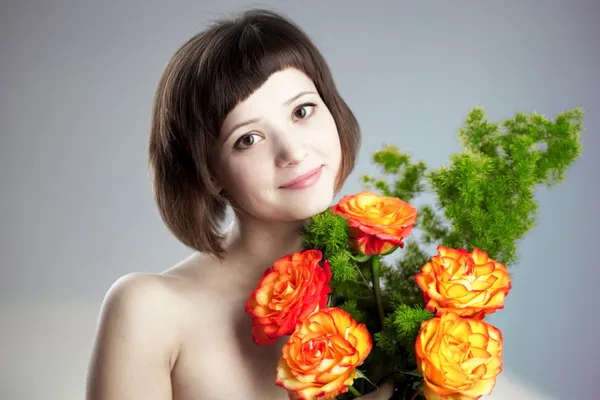 花を持つ女性 ストック写真