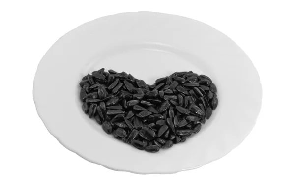 Roasted seeds in the shape of a heart — Stock Photo, Image
