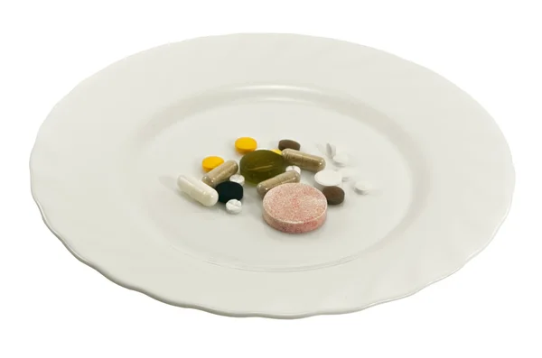Pilules sur une assiette — Photo