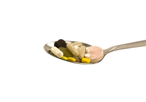 Spoonful of pills — Stock Photo, Image