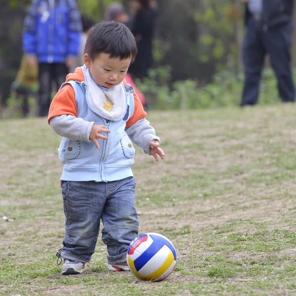 Stock image Baby playing football