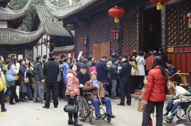 Crowded waiting in line to enter a temple clipart