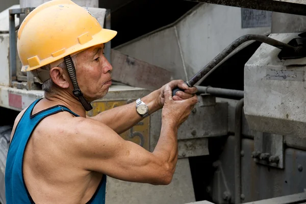 stock image Hardworking laborer on construction site