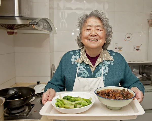 Cooking grandmother — Stock Photo, Image