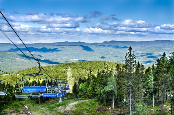 Ski lift chairs on summer's day — Stock Photo, Image