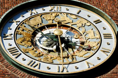 Astronomical clock on wall City Hall clipart