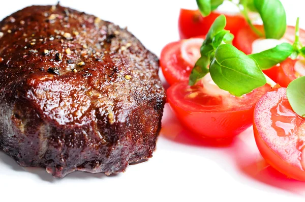 Steak s rajčaty zblízka — Stock fotografie