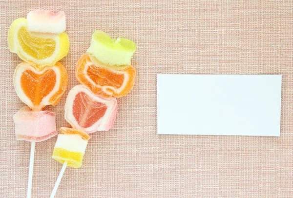 Colorful jelly candy stick and white paper label — Stock Photo, Image